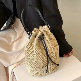 Women's summer straw shoulder bag: Hand - woven drawstring bucket style - Bayu